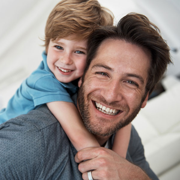 father and son smiling