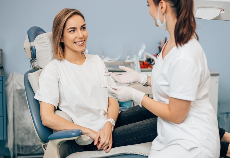 A patient and dentist discussing general dental treatments in a professional clinic in Kenosha, WI